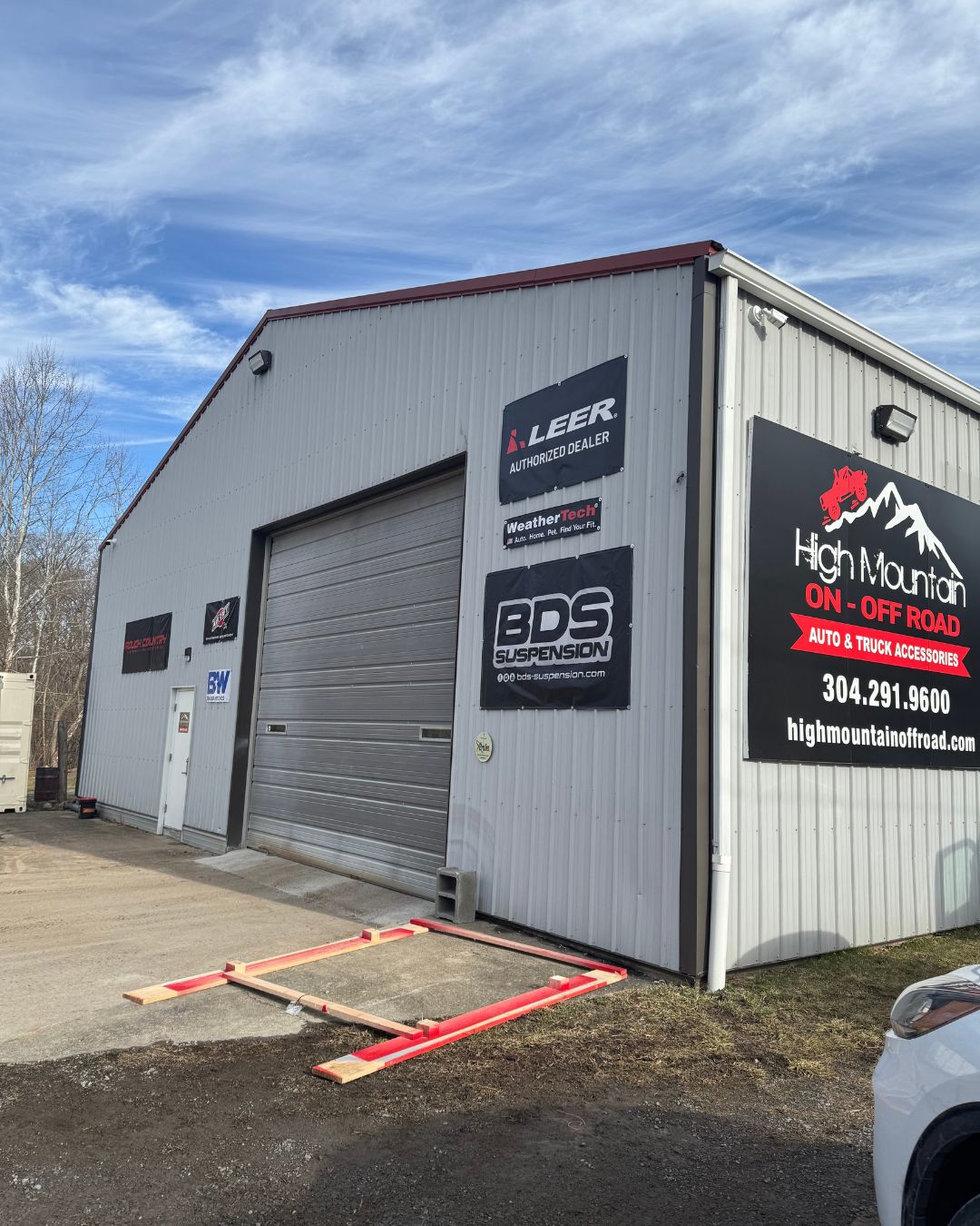 Exterior of High Mountain On-Off Road, an automotive shop specializing in truck accessories and suspension upgrades.